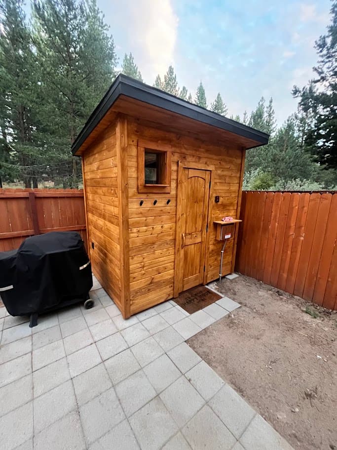 6x8 Finnish-style outdoor sauna with single-pitch roof, pine exterior, and small picture window – backyard in South Lake Tahoe