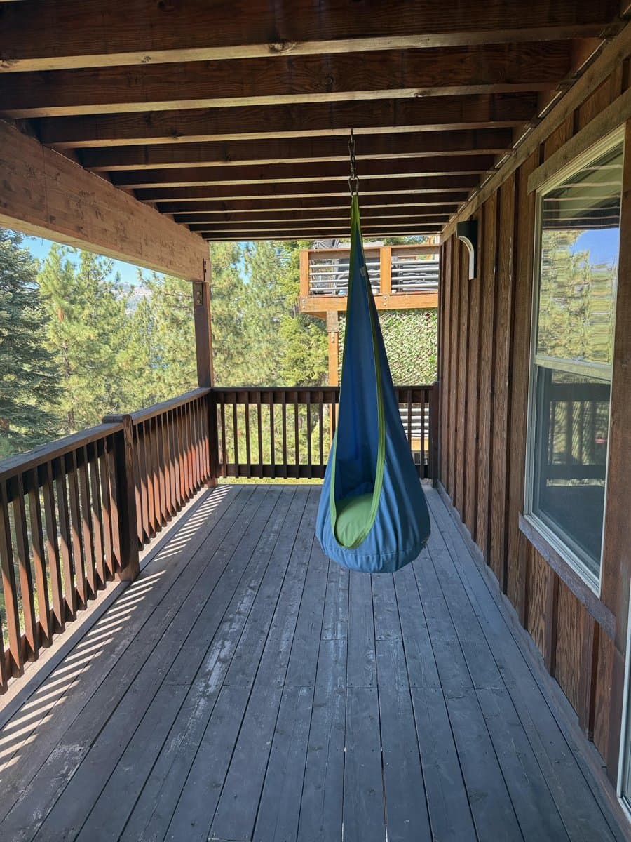 The covered lower deck in Truckee before the sauna went in — the sauna sits under the upper deck, out of the snow