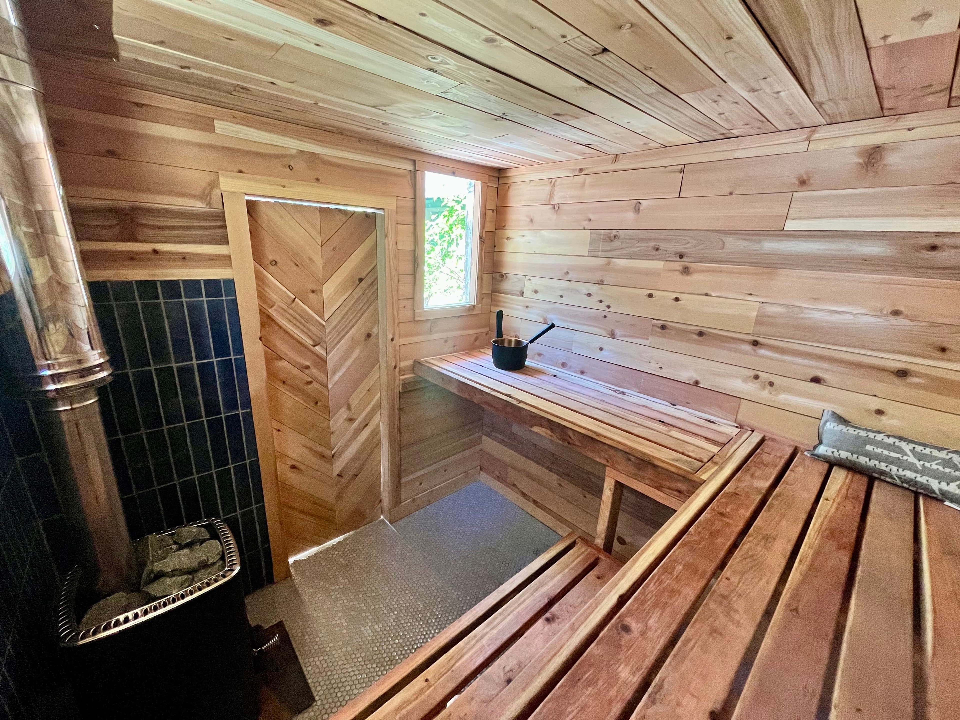 Cedar wall cladding and bench detail in custom wood-fired sauna