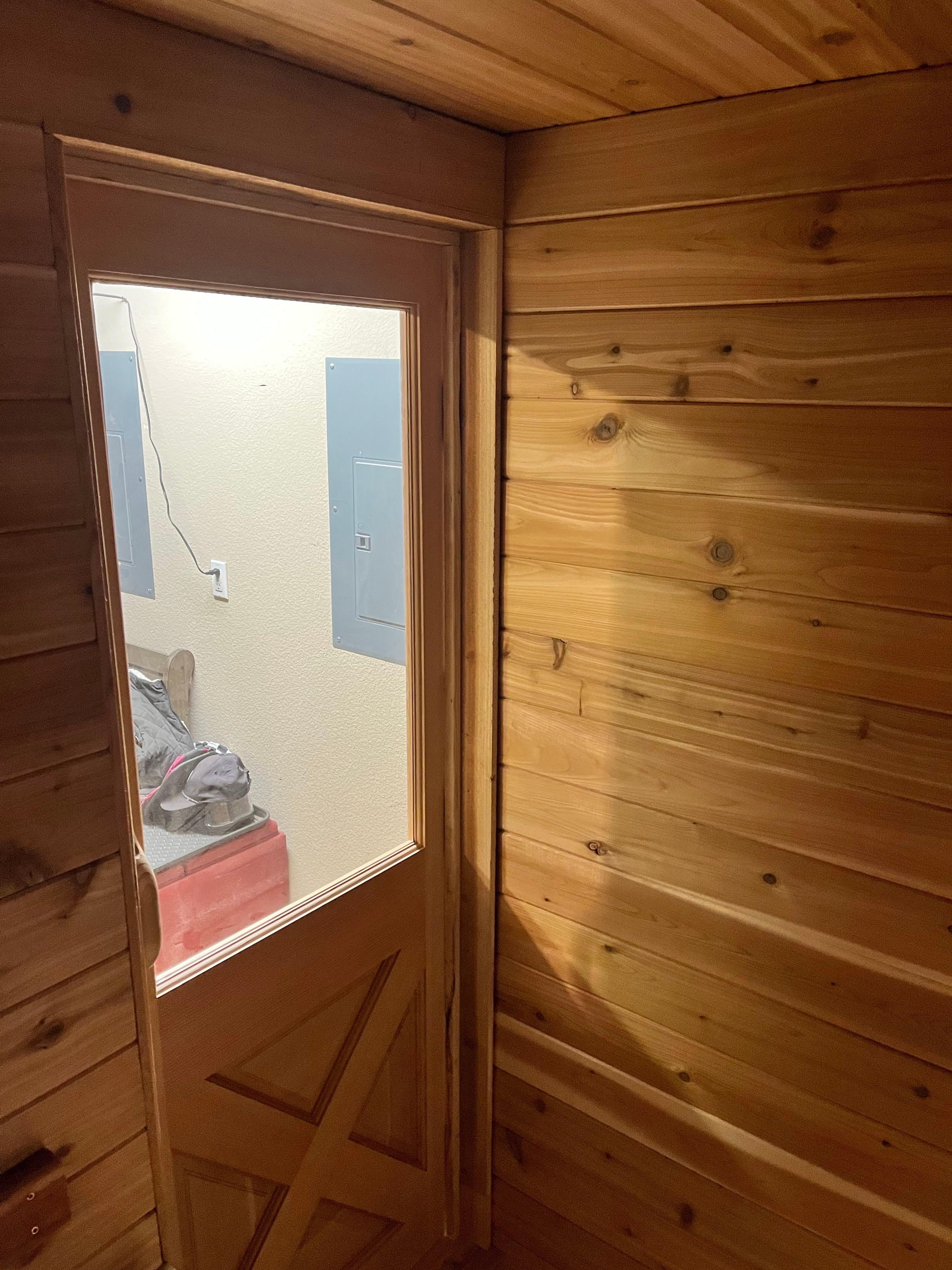 Small sauna bench layout with heater clearance – Reno garage build