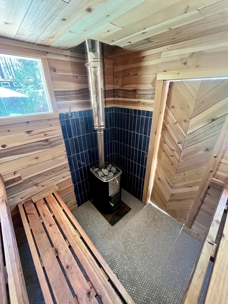 Sauna heater clearance and bench layout